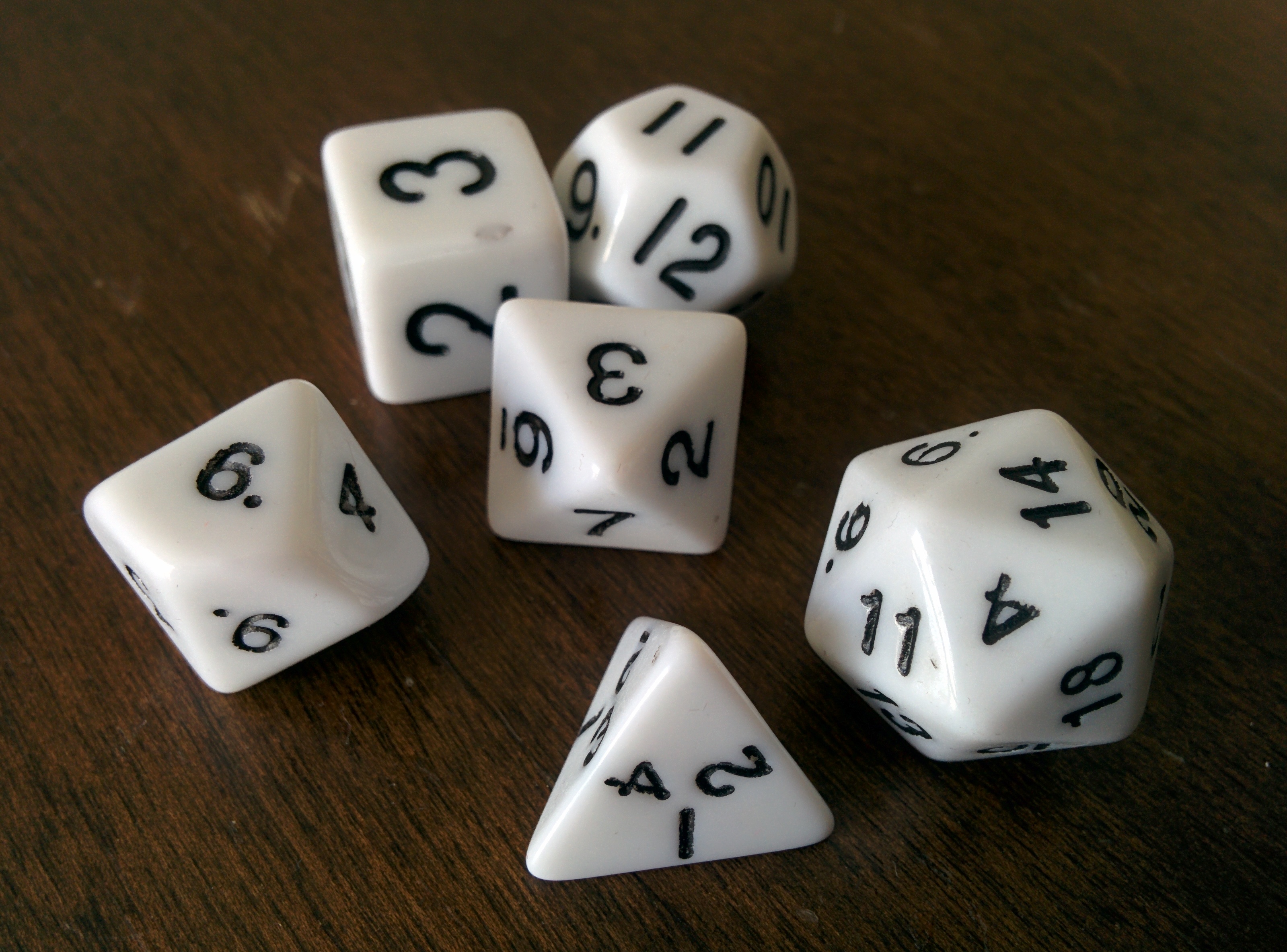 A polyhedral RPG dice set on felt